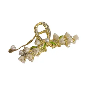 کلیپس مو زنانه مدل فلزی گل های شیپوری ریز