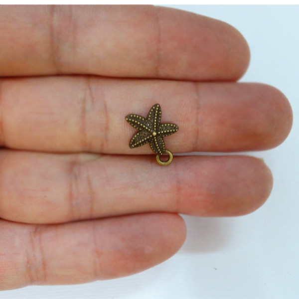 آویز دستبند دخترانه مدل ستاره دریایی کد AD 575 مجموعه 10 عددی