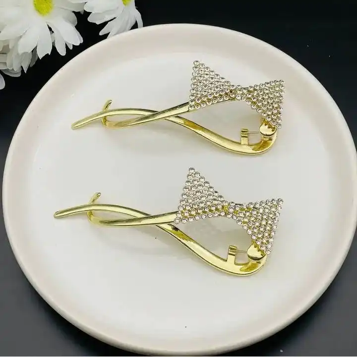 گیره مو زنانه مدل نگینی طرح پاپیونی