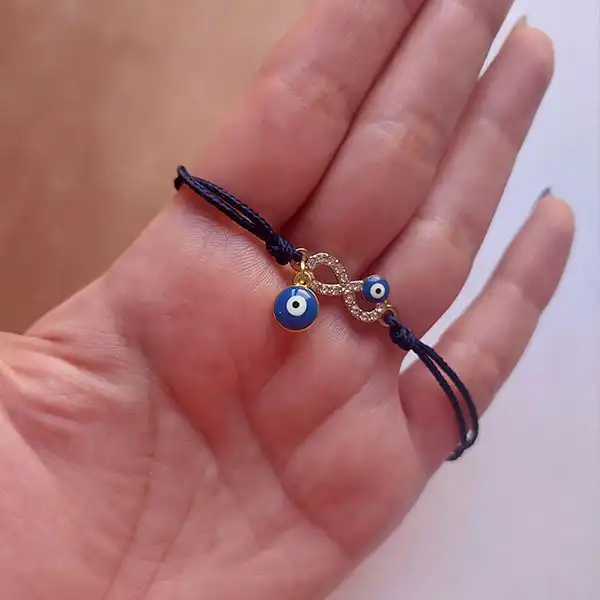 دستبند زنانه مدل نخی طرح بی نهایت با آویز چشم نظر کد HC365