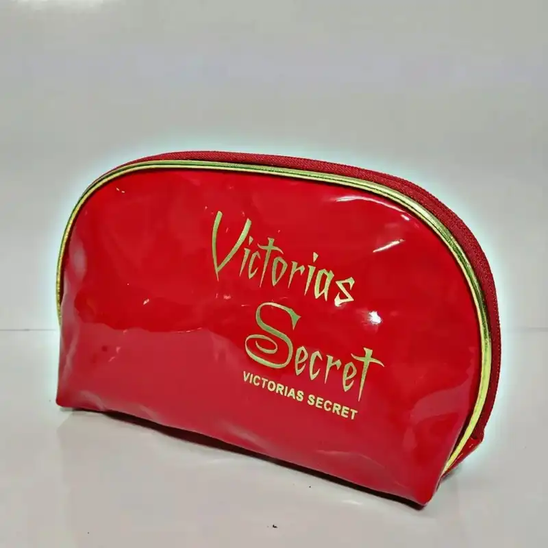 کیف لوازم آرایش زنانه مدل نیمگرد ورنی براق