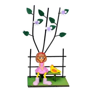 مجسمه طرح دختر و پرنده روی نیمکت کد GR BRD 36