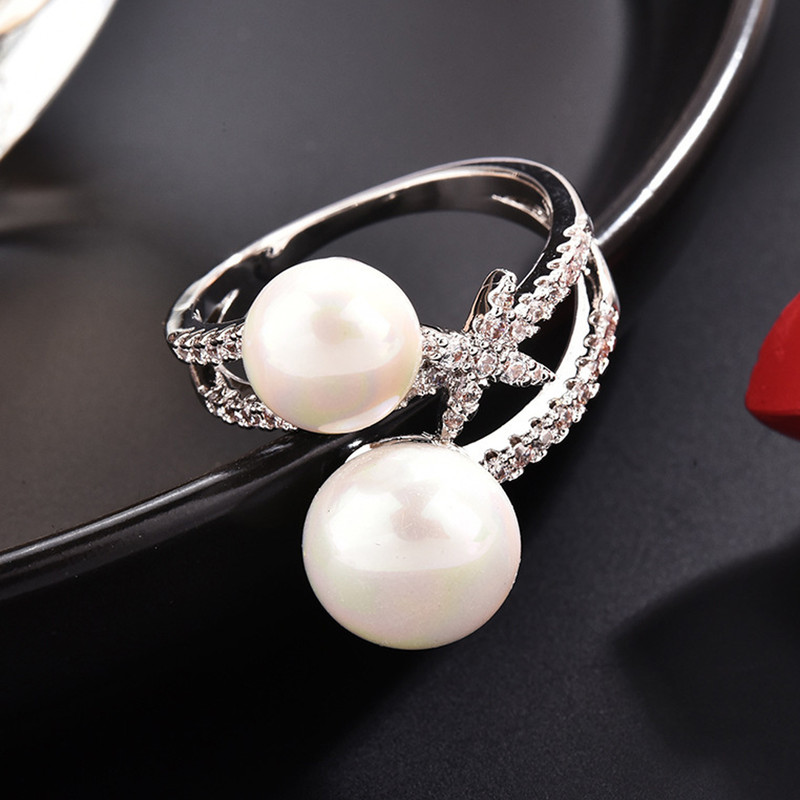 انگشتر زنانه مدل دو مروارید کد 00683 انگشتر زنانه مدل دو مروارید کد 00683