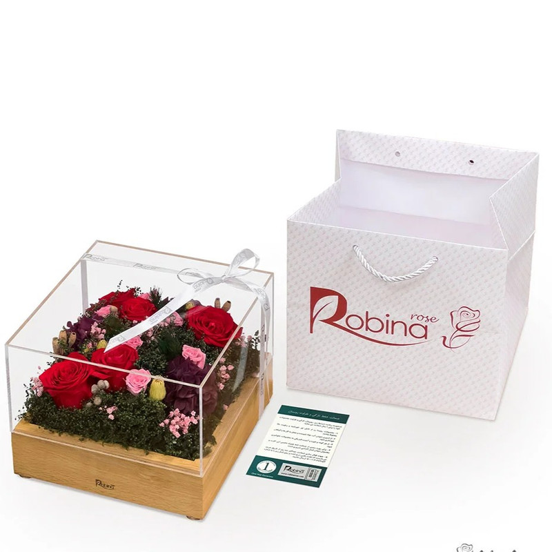 گل جاودان روبینا مدل رز هلندی، 5 شاخه رومیزی، در باکس سوپرایزی، ماندگاری تا 3 سال، مناسب فضای باز و آپارتمانی، ابعاد 22×22×15 سانتی‌متر