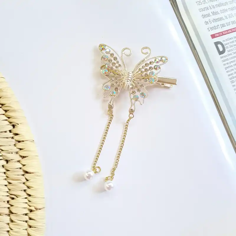 گیره مو زنانه مدل پروانه نگین‌دار مجلسی آویزدار کد brg 879