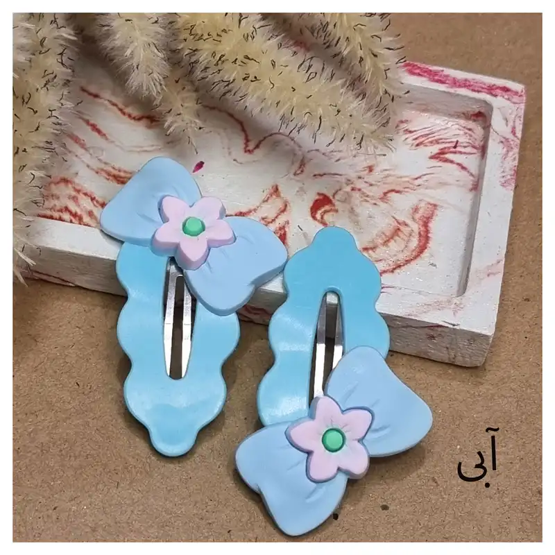 گیره مو زنانه مدل تق تقی پیکسل دار کد03 بسته 2 عددی