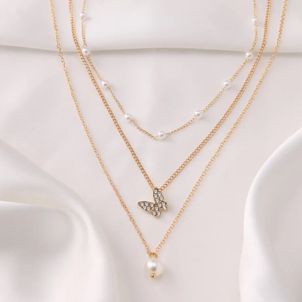 گردنبند دخترانه مدل مروارید و پروانه مجموعه سه عددی گردنبند دخترانه مدل مروارید و پروانه مجموعه سه عددی