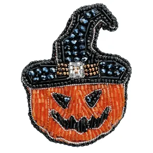 گل سینه زنانه مدل کدو هالووین 