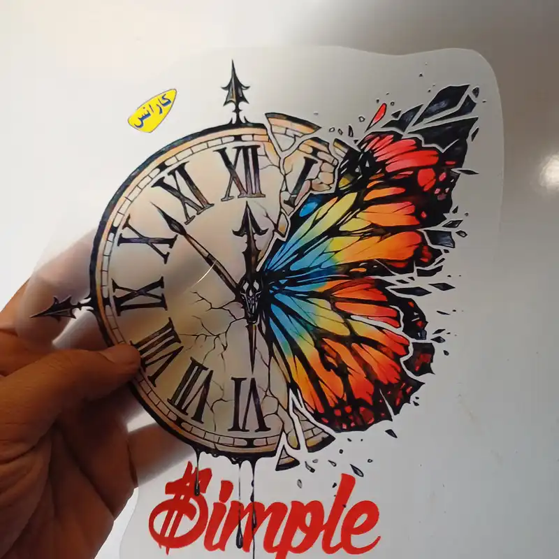 استیکر پارچه و لباس کارانس طرح ساعت و پروانه مدل AST-16