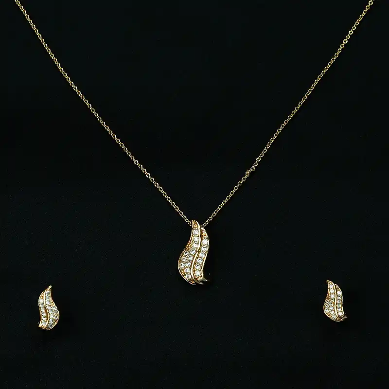 نیم ست زنانه مدل برگ نگین دار رنگ طلایی