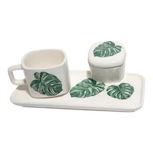 ست فنجان و قندان سرامیکی طرح برگ به همراه زیر لیوانی