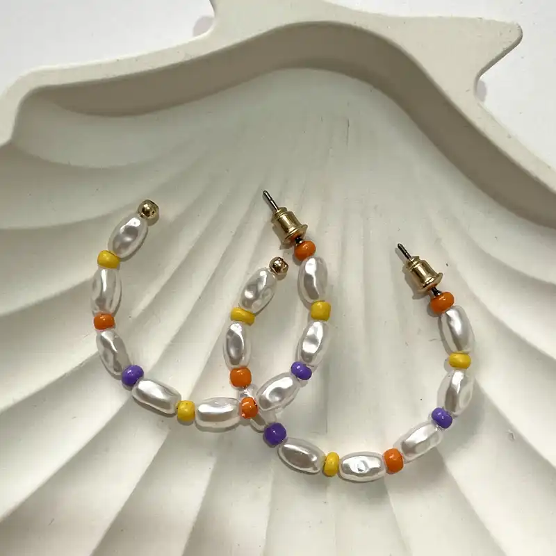 گوشواره زنانه اکسسورایز مدل مروارید پرورشی نیم حلقه ای