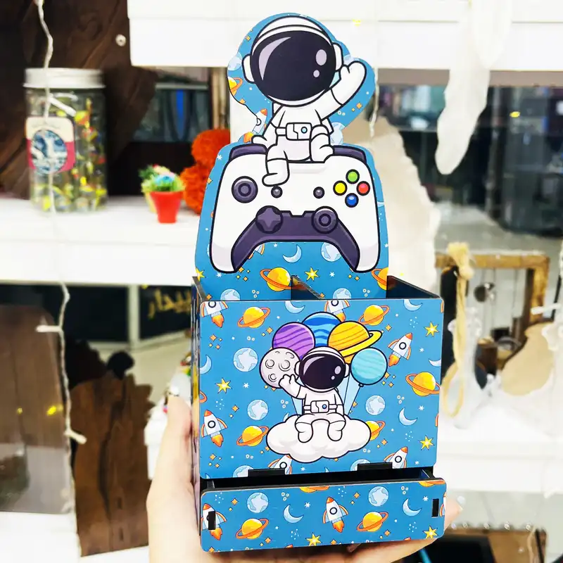 جامدادی رومیزی مدل فضانورد و پلی استیشن