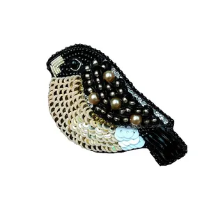 گل سینه زنانه مدل پرنده کوچک