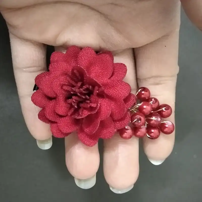 گیره مو دخترانه مدل گل پرچمی مجموعه دو عددی