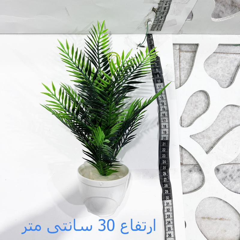 گلدان به همراه گل مصنوعی مدل سوزنی کریسمس گلدان به همراه گل مصنوعی مدل سوزنی کریسمس