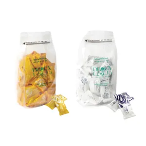  خرما شکلاتی موزی و سفید با مغز بادام دلوکا - ۵۰۰ گرم بسته 2 عددی