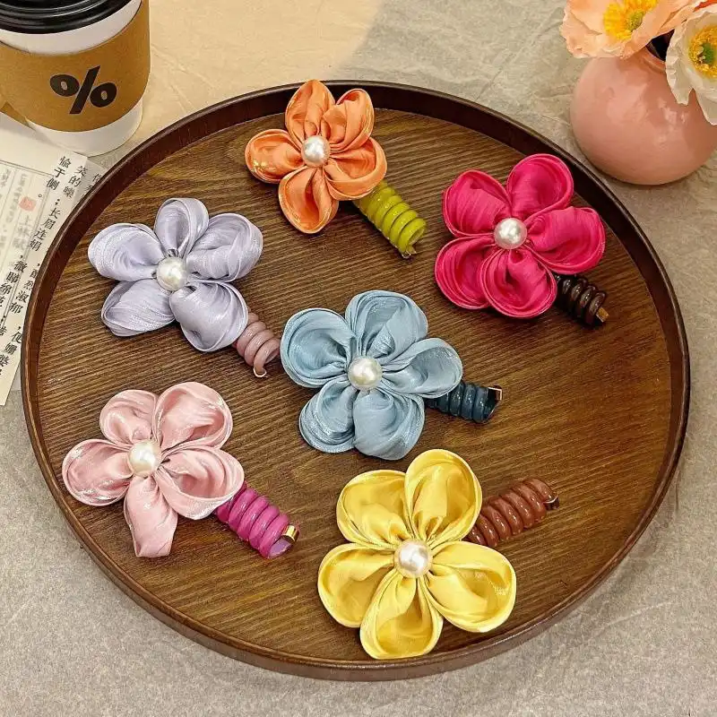 کش مو زنانه مدل فنری طرح گل کاغذی