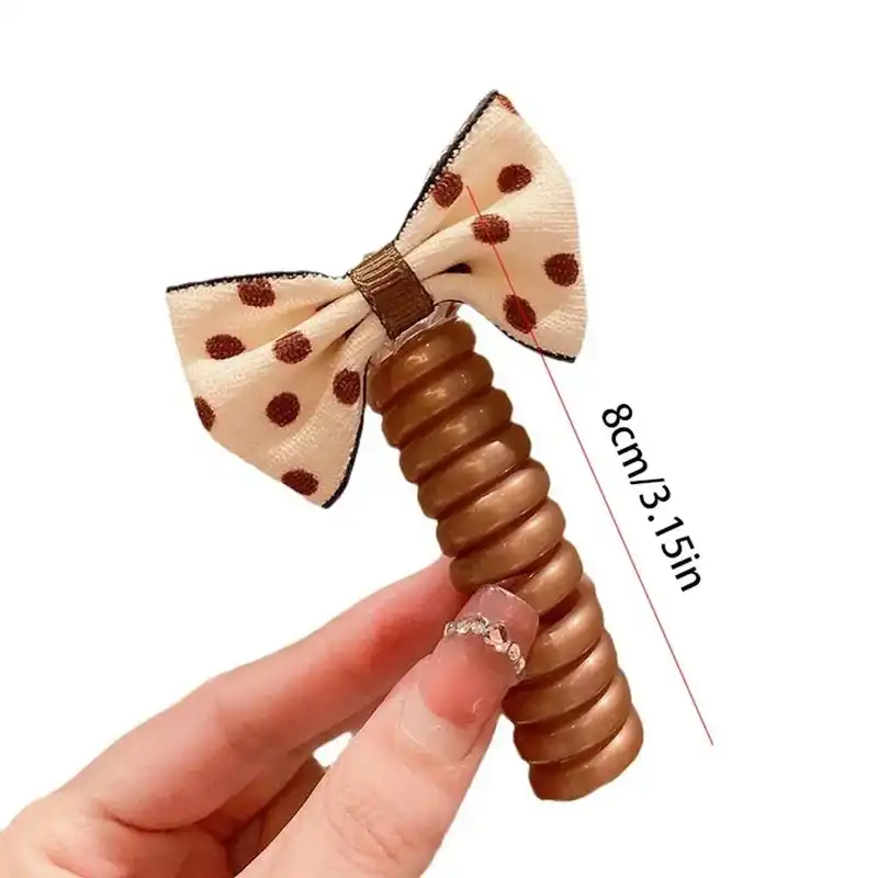 کش مو زنانه مدل فنری طرح پاپیون خال دار