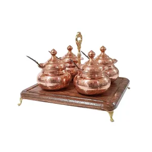 جا‌ادویه مسی مدل لب چین به همراه قاشق و پایه مجموعه 4 عددی