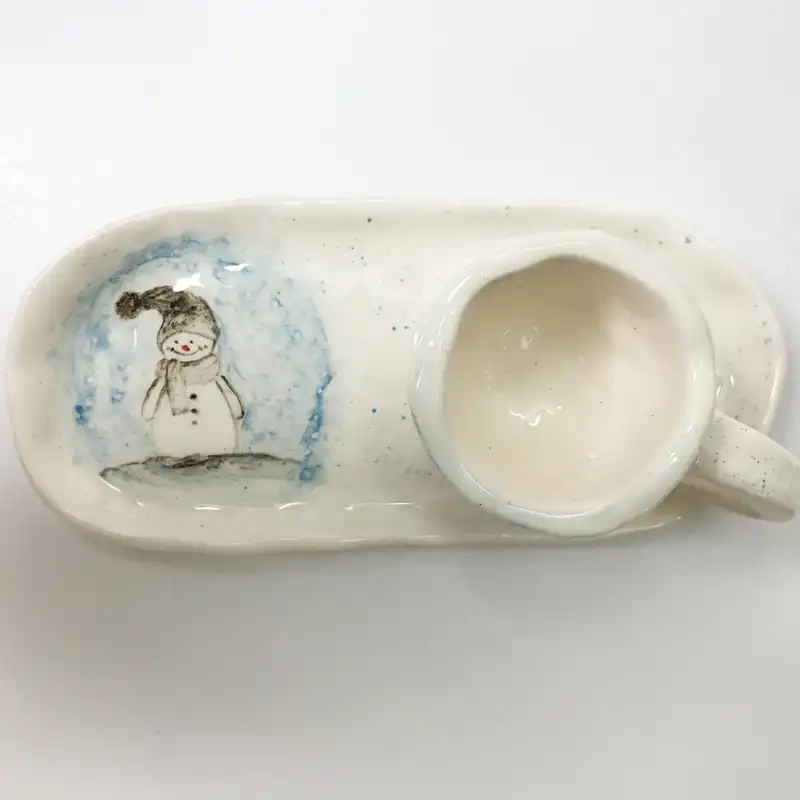 ست فنجان و زیر لیوانی سرامیکی طرح آدم برفی