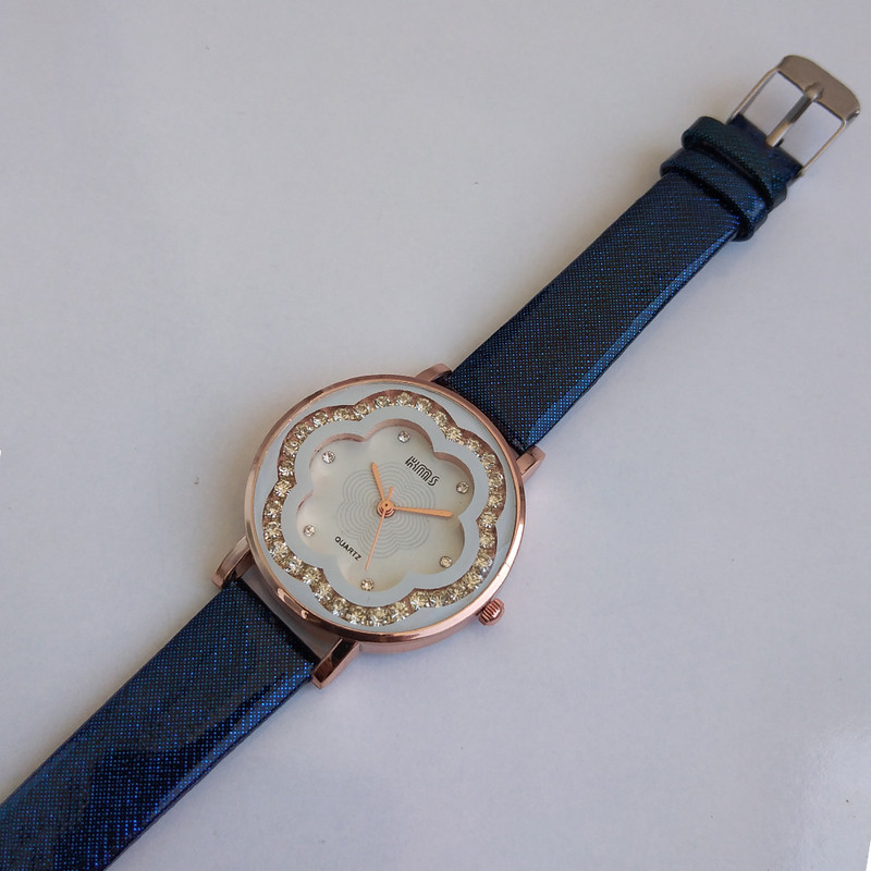 ساعت مچی عقربه ای دخترانه مدل طرح گل کد 250 ساعت مچی عقربه ای دخترانه مدل طرح گل کد 250