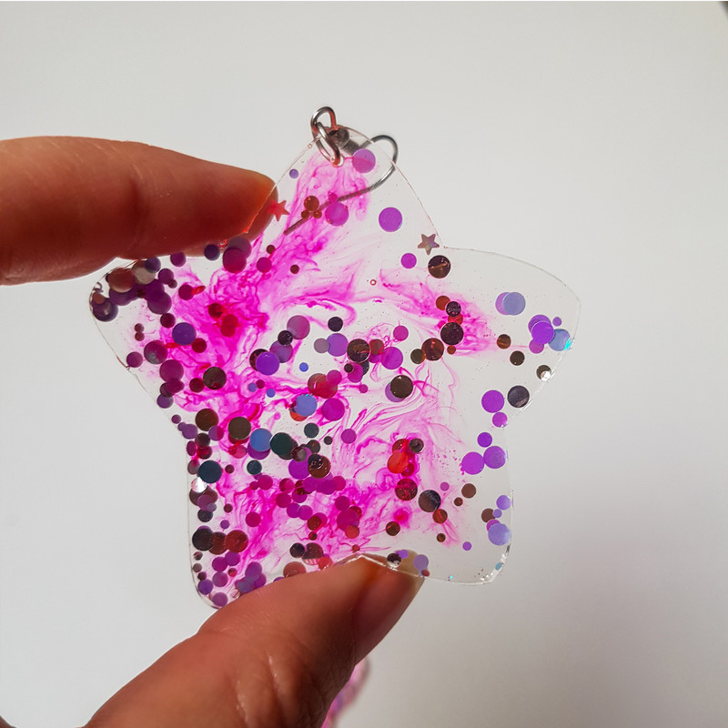 گوشواره دخترانه مدل رزینی طرح ستاره گوشواره دخترانه مدل رزینی طرح ستاره