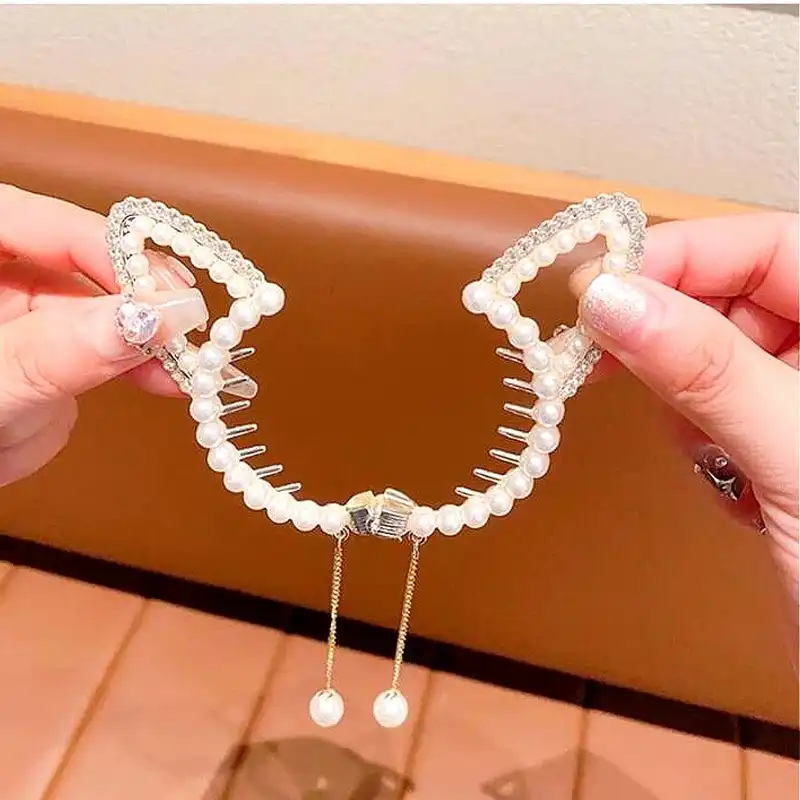 گیره مو زنانه مدل گوجه‌ای گوش گربه مرواریدی آویزدار کد 780