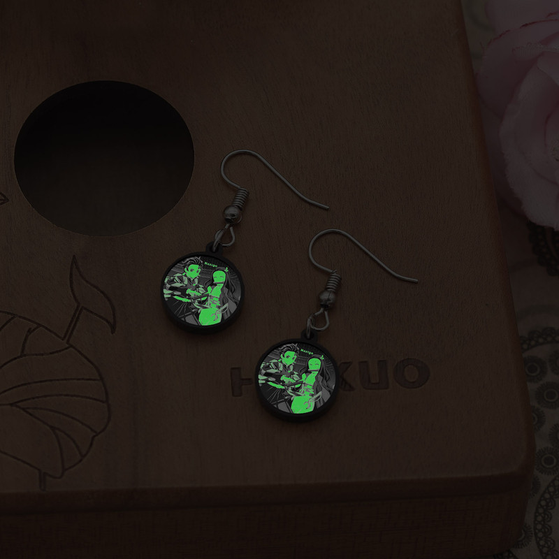 گوشواره زنانه ناکسیگو مدل شب تاب طرح شیطان کش کد ES8435 گوشواره زنانه ناکسیگو مدل شب تاب طرح شیطان کش کد ES8435