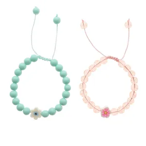 دستبند دخترانه دلنار گالری مدل چشم نظر و شکوفه بسته 2 عددی