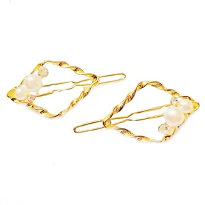 گیره مو زنانه مدل مرواریدی گوش ماهی بسته 2 عددی