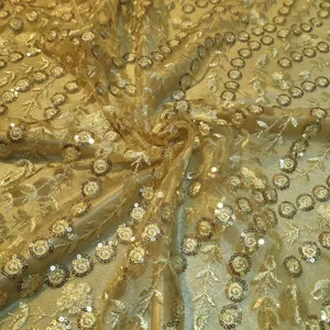 پارچه لباس عرض ۱.۴ متر مدل تور پولکی گلدار  رنگ طلایی