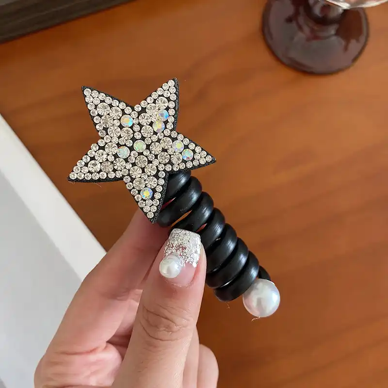 کش مو زنانه مدل فنری طرح ستاره نگینی