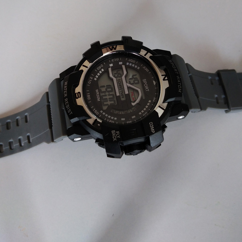 ساعت مچی دیجیتال پسرانه مدل FLY BACK SPORT کد GRY 25 ساعت مچی دیجیتال پسرانه مدل FLY BACK SPORT کد GRY 25