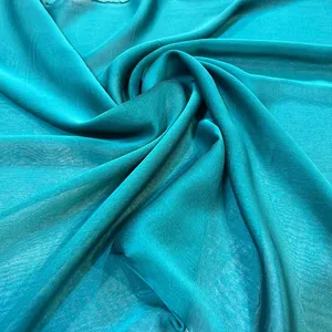 پارچه لباس عرض 1.5 متر مدل حریر ملانژ کله غازی رنگ آبی