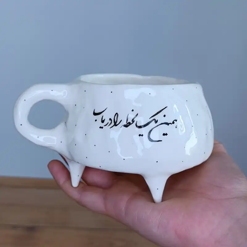 ماگ  سرامیکی طرح دفرمه مدل شعرنوشته