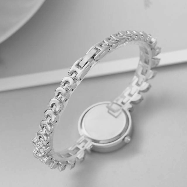 ساعت مچی عقربه ای زنانه مدل دور نگین بند نگین دار گندمی ساعت مچی عقربه ای زنانه مدل دور نگین بند نگین دار گندمی