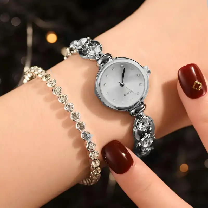 ساعت مچی عقربه ای زنانه مدل بند نگین دار دستبندی کد 2