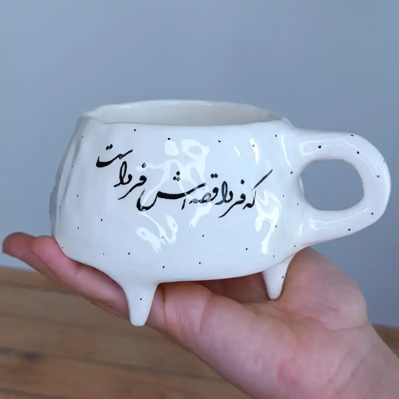 ماگ  سرامیکی طرح دفرمه مدل شعرنوشته