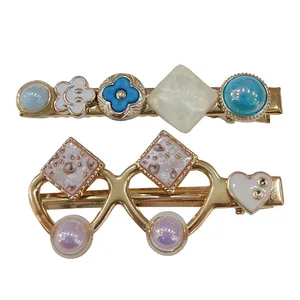 گیره مو زنانه مدل مجلسی نگین دار فلزی طرح عینک بسته 2 عددی