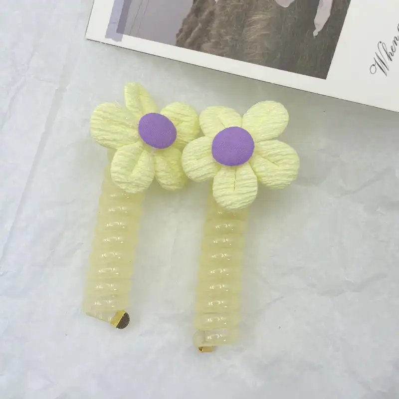 کش مو زنانه مدل فنری طرح گل بابونه