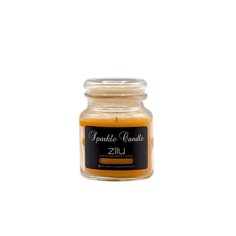 شمع لیوانی معطر شمع زیلو مدل اسپارکل کوچک با رایحه انبه زمان اتمام 35 ساعت