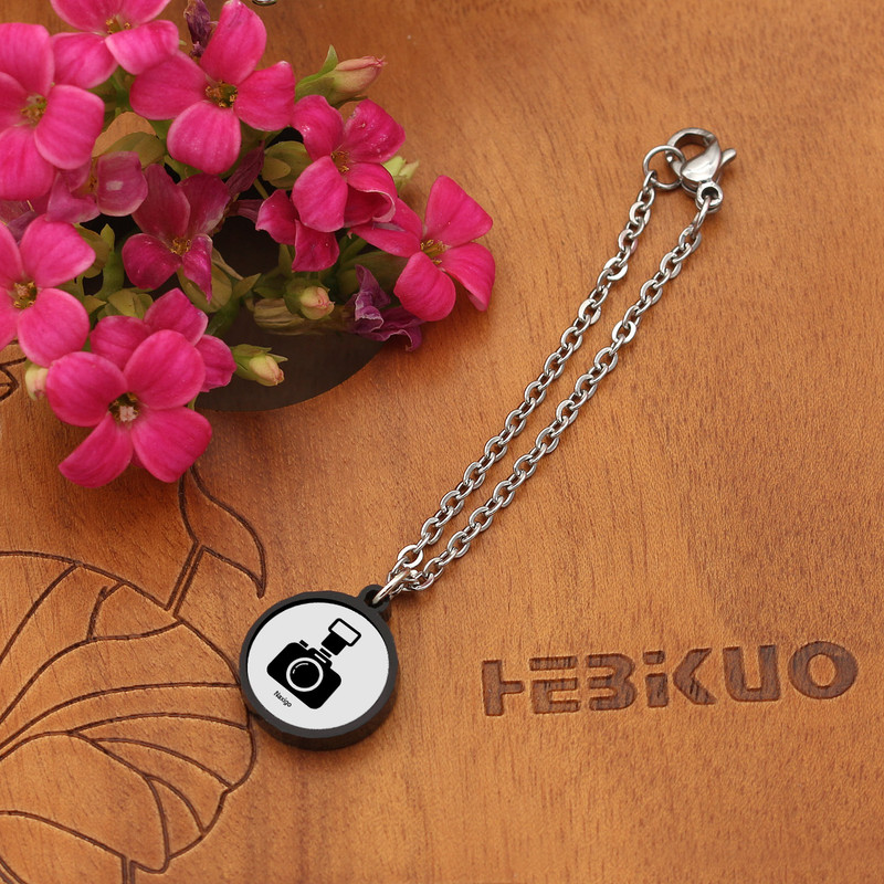 آویز ساعت زنانه ناکسیگو مدل شب تاب طرح عکاسی کد AW7278