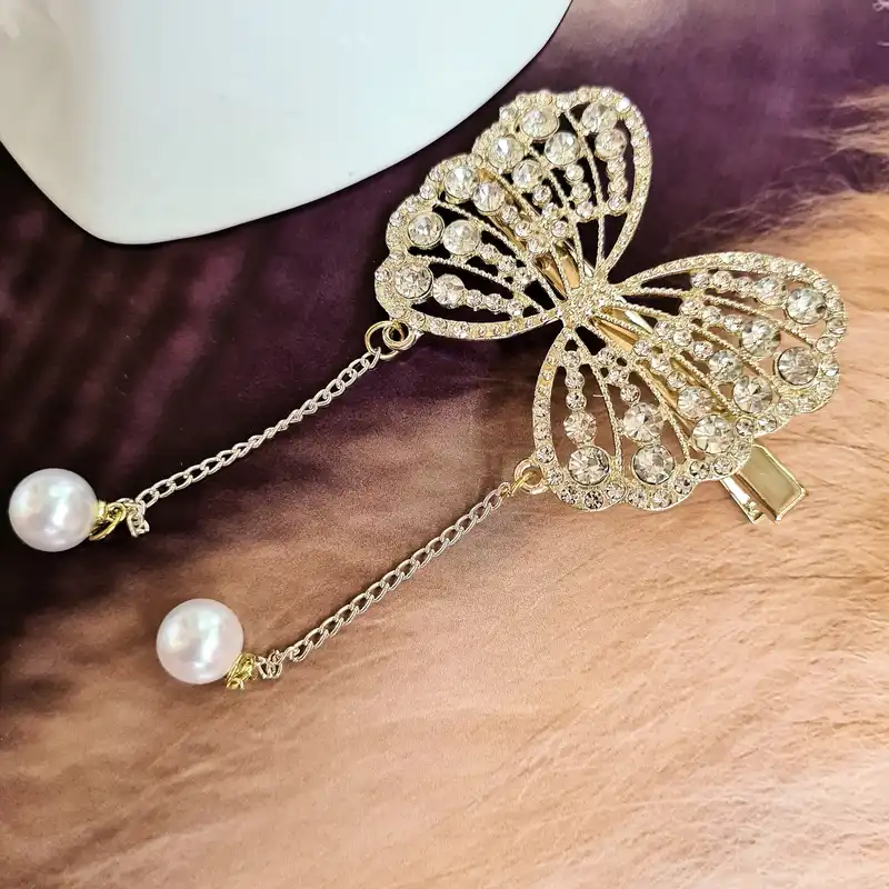 گیره مو زنانه مدل بال پروانه نگین‌دار مجلسی آویزدار کد brg 874