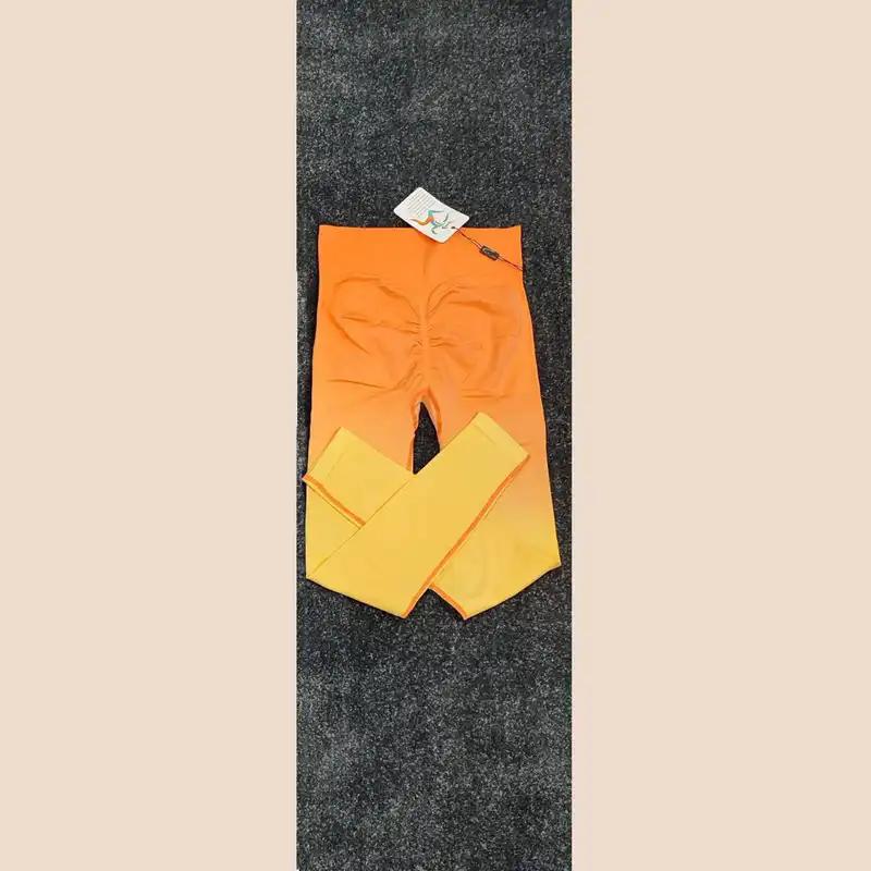 لگینگ ورزشی زنانه مدل فلورسنت کالر پلت سیملس پشت چین دار کد oy1