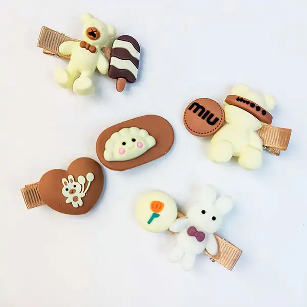 گیره مو زنانه مدل سیلیکونی 4018 طرح تدی کارت فانتزی  رنگ کرم قهوه ای مجموعه 14 عددی