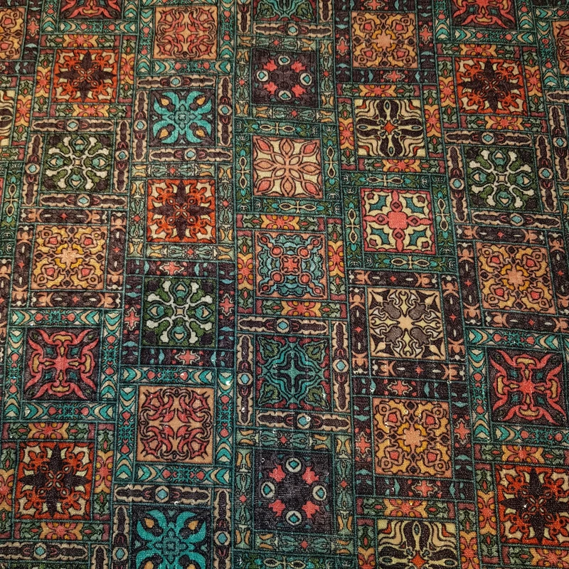 پارچه لباس عرض ۱.۱ متر مدل مخمل باتیک رنگ سبز آبی