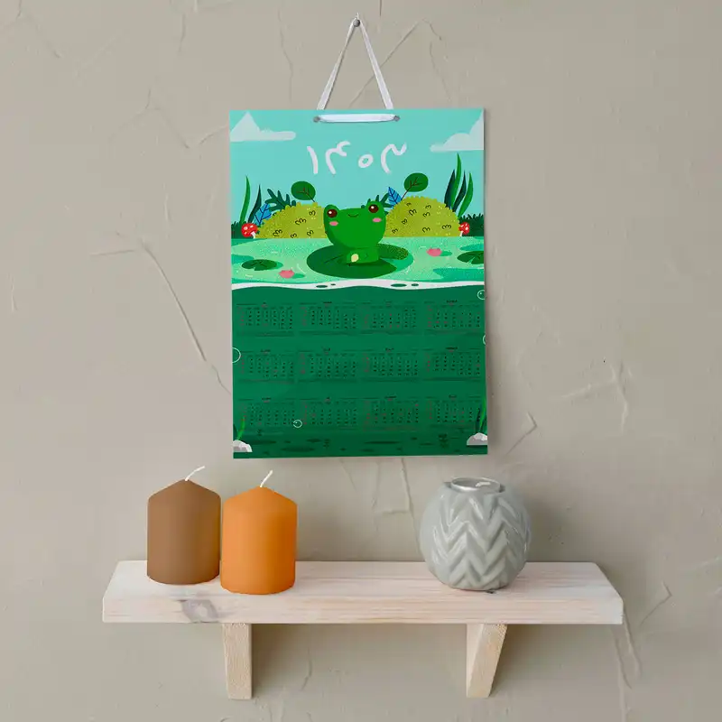 تقویم دیواری سال 1403 خندالو مدل قورباغه کودکانه کد E6