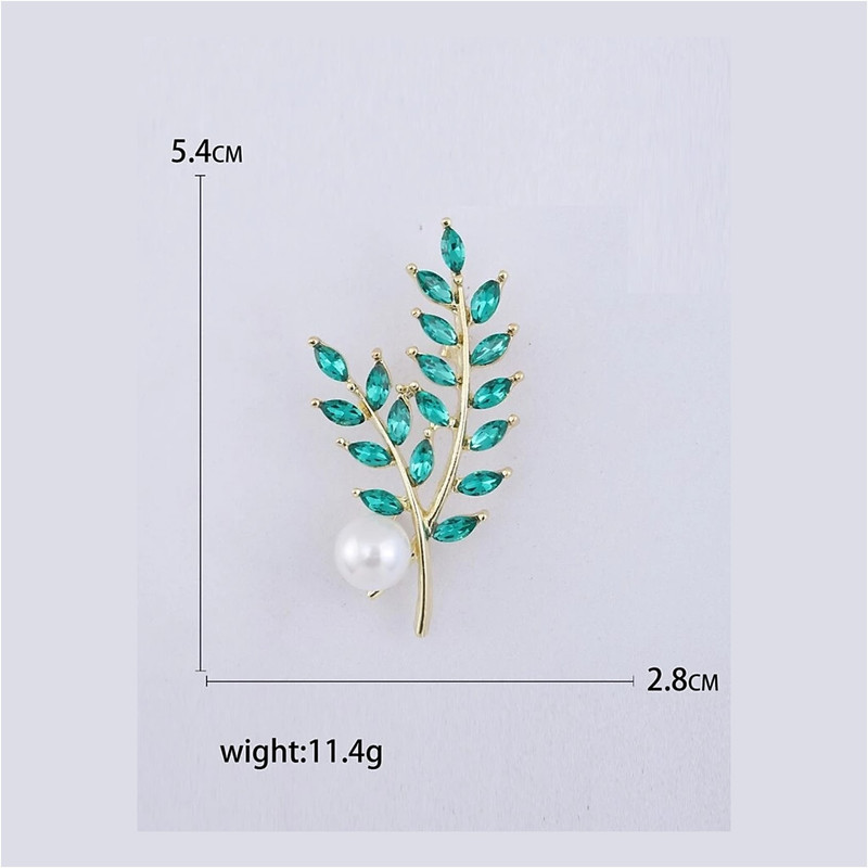 گل سینه زنانه مدل شاخه زمرد طرح مارکیز و تک مروارید کدngr321