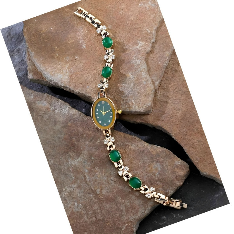 ساعت مچی عقربه ای زنانه مدل نگین دار دستبندی طرح زمردی ساعت مچی عقربه ای زنانه مدل نگین دار دستبندی طرح زمردی